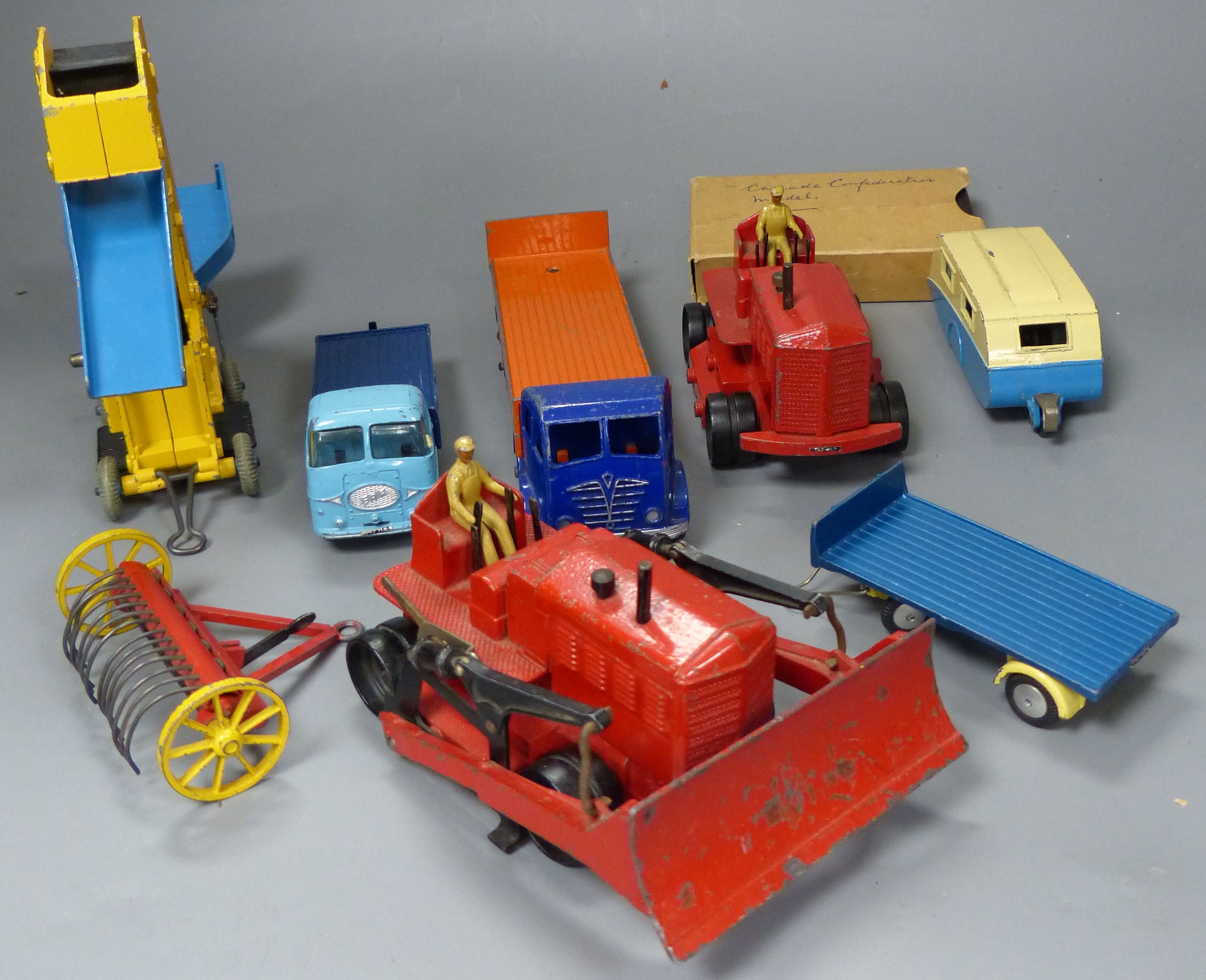 A group of mixed diecast to include Dinky and Corgi toy diggers, tractors, etc. 7 items and a commemorative Canadian medal